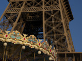 The juxtaposition of the strength of the Eiffel Tower and the whimsical feel of the carousel